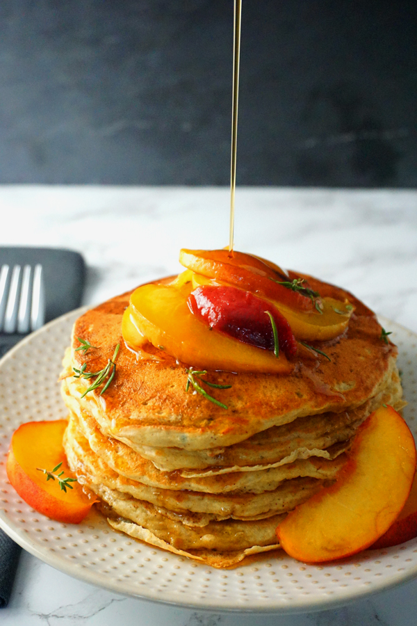 fluffy buttermilk peach pancakes topped with rosemary peach sauce and pure maple syrup | Frydae