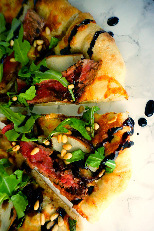 Flank Steak Pizza with pear, boursin cheese, arugala and balsamic glaze