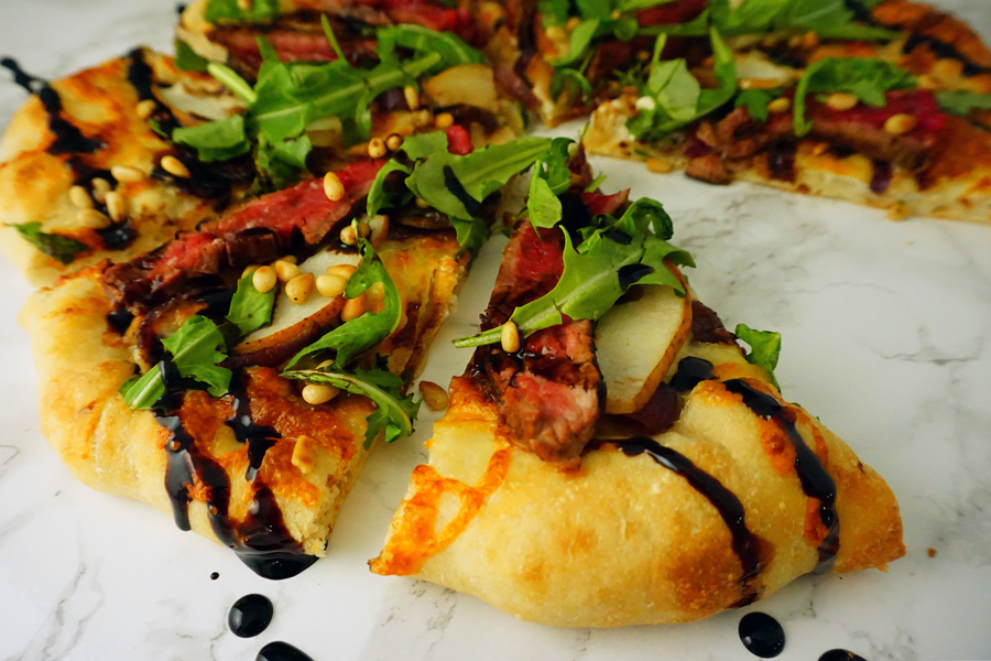 Flank Steak Pizza with pear, boursin cheese, arugala and balsamic glaze