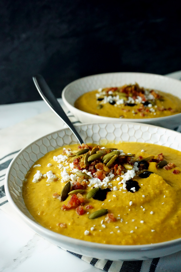 creamy butternut squash pumpkin soup with apples, pancetta and goat cheese