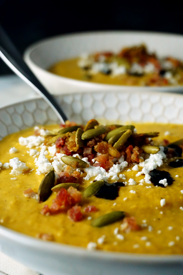 creamy butternut squash pumpkin soup with apples, pancetta and goat cheese