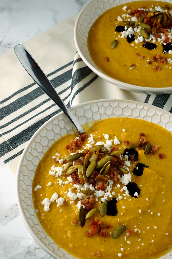 creamy butternut squash pumpkin soup with apples, pancetta and goat cheese