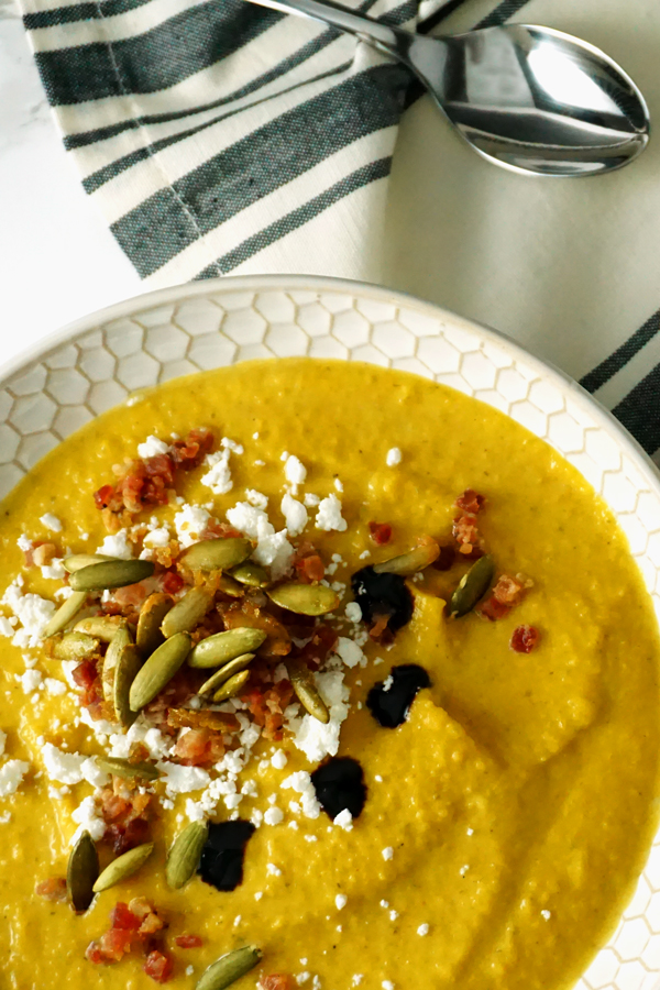 creamy butternut squash pumpkin soup with apples, pancetta and goat cheese