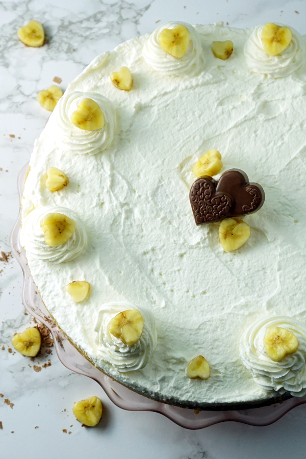 Black-bottom coconut banana cream pie garnished with a chocolate heart