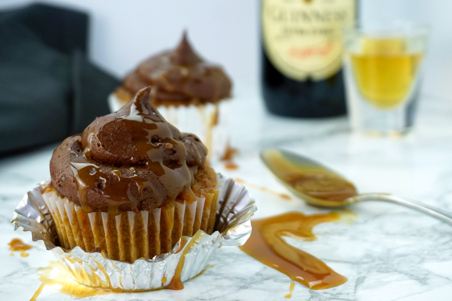 A caramel-flavored cupcake with chocolate buttercream and caramel drizzle