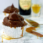 A caramel-flavored cupcake with chocolate buttercream and caramel drizzle