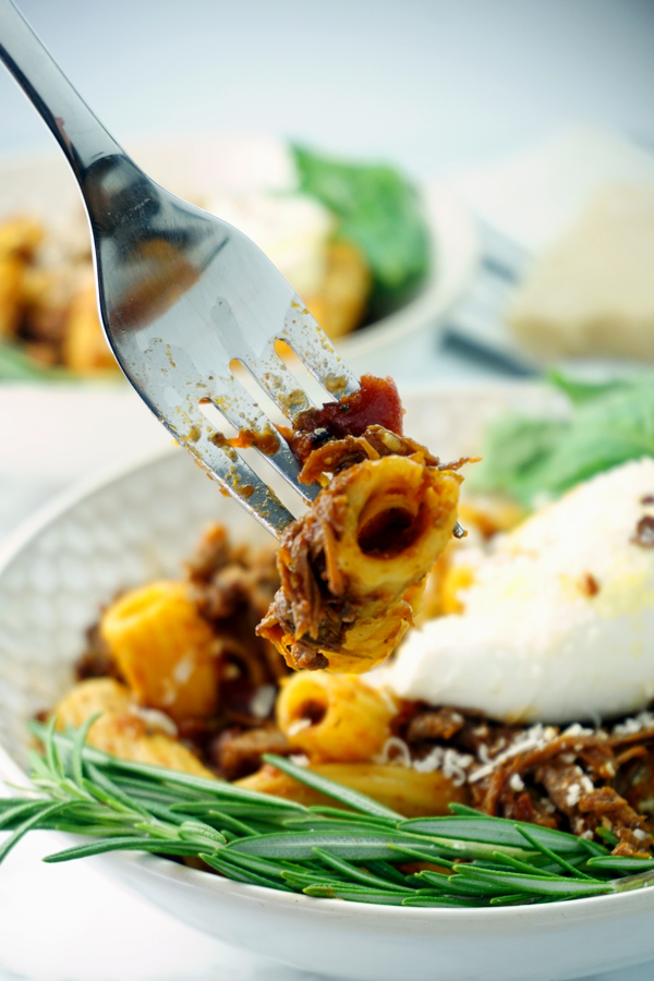 Two bowls of instant pot cabernet-braised beef short rib rigatoni with burrata