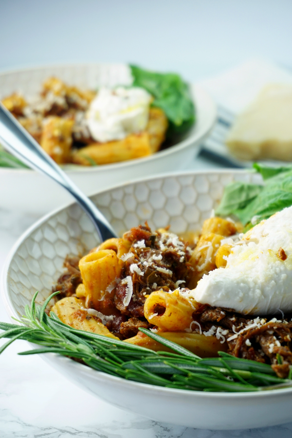 Two bowls of instant pot cabernet-braised beef short rib rigatoni with burrata