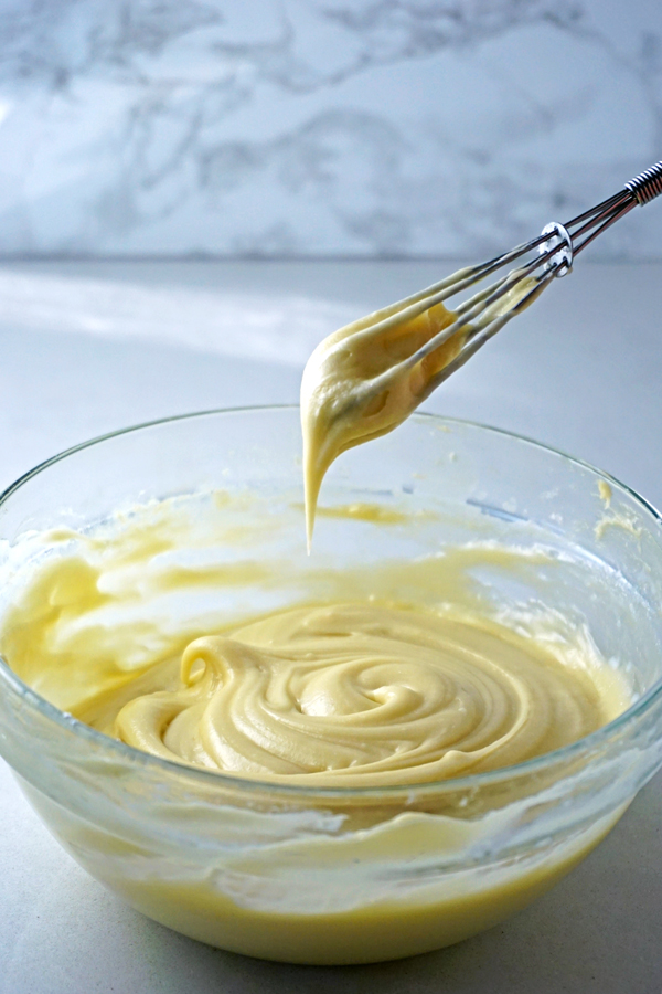 homemade cream cheese icing with a whisk