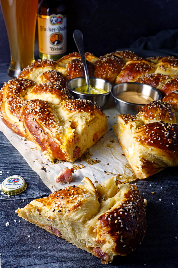 a slice of bavarian braided pretzel wreath stuffed with ham and cheese